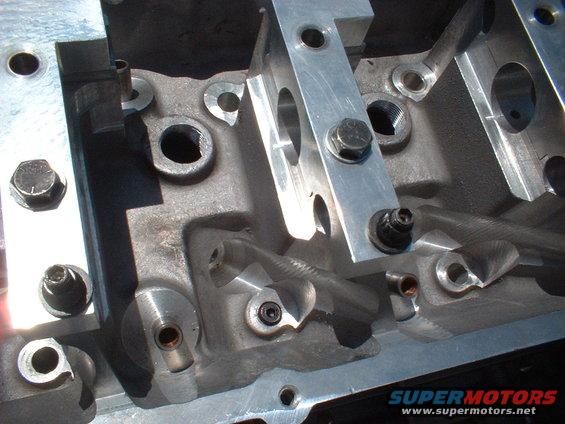 Close-up of engine block with metal brackets and bolts