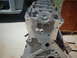 1964 Ford 427 - Engine block components are visible, with a car body in the background.