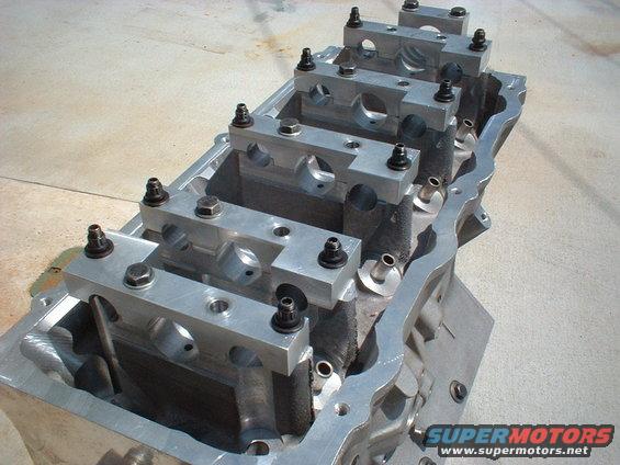 Engine block with main bearing caps installed. Some bolts are visible