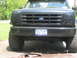 1995 Ford Bronco - Front view of a black Ford Bronco, its grille and license plate.