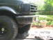 1995 Ford Bronco - Front view of a 1995 Ford Bronco, showing the grille and bumper details.