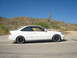 1997 Ford Probe - A white coupe sits on the side of a road with a desert landscape behind it.