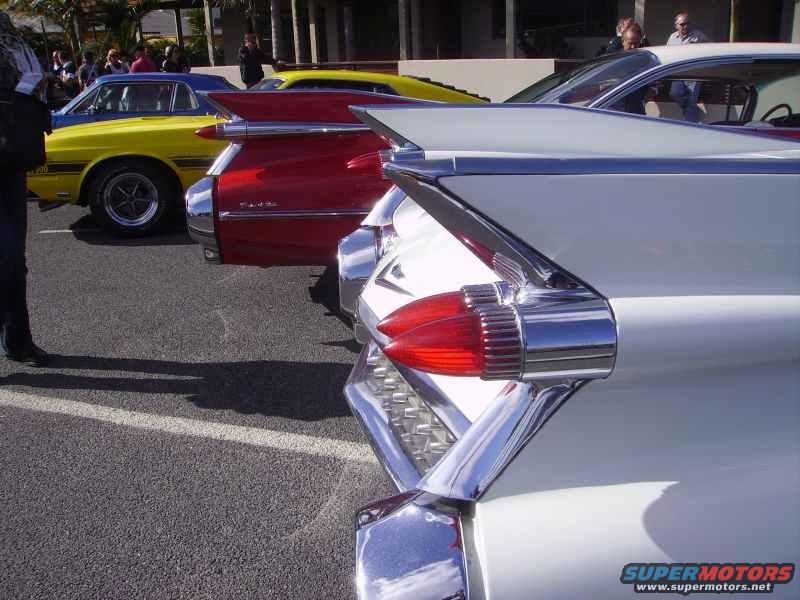 White car tail fins and taillights with chrome accents