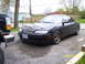 1997 Mazda MX-6 - Black 1997 Mazda MX-6 coupe with aftermarket wheels parked outside.