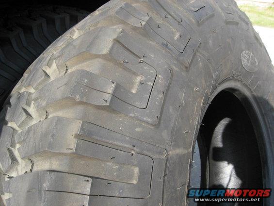 Close-up of a large, aggressive off-road tire tread pattern