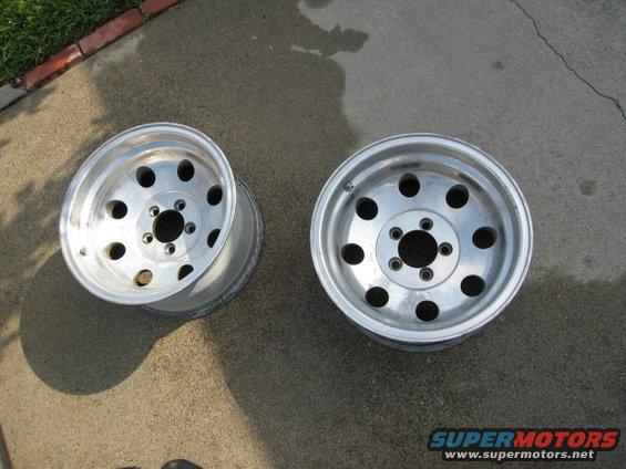 Two aluminum alloy wheels with 5 lug holes each