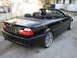 2002 BMW 3 Series - This black BMW 330 Ci convertible is shown from a rear three-quarter angle.