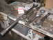 1979 Ford Bronco - Several driveshafts and yokes are laid out on a workbench, with two boxes of Spicer parts visible.