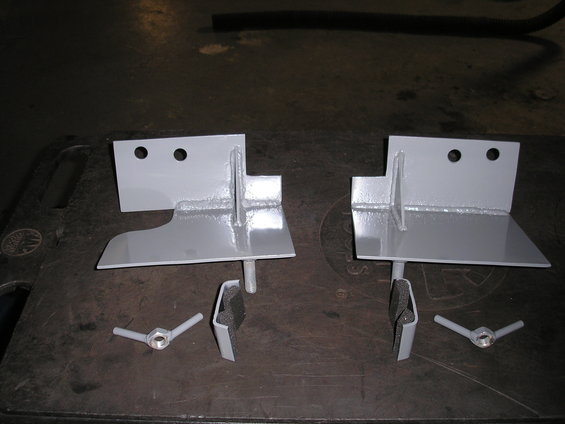 Pair of gray hi-lift jack mounts with wing nuts and foam padding