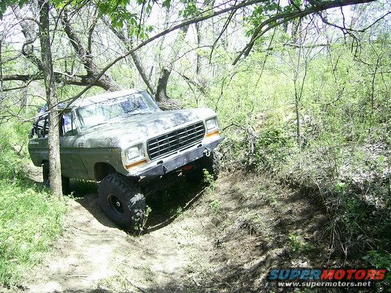 1978 Ford Bronco on a wooded trail, front quarter view