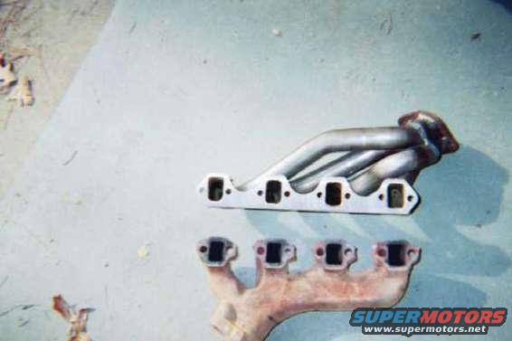 08_08.jpg Stock exhaust manifold compared to the new headers.  Notice the port size difference.
