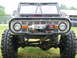 1992 Ford Mustang - This heavily modified 1974 Ford Bronco features a prominent winch and off-road tires, contradicting the claim of a 1992 Ford Mustang.