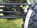 1992 Ford Mustang - The drivetrain components and a new tire are visible on this off-road vehicle.