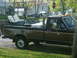 1991 Ford F-250 - This 1991 Ford F-250 has a custom golf cart setup in its bed.