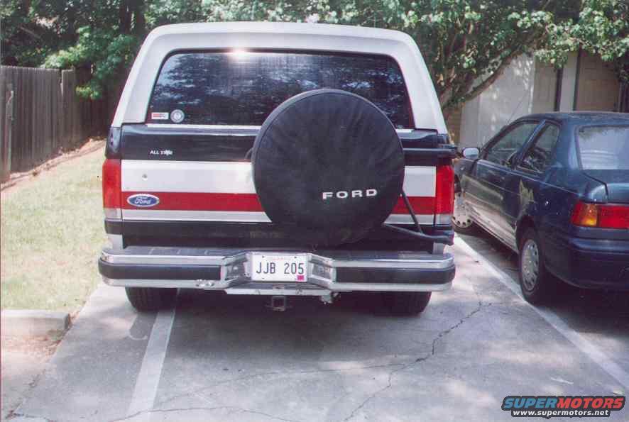 Rear view of 1990 Ford Bronco with spare tire and red stripe