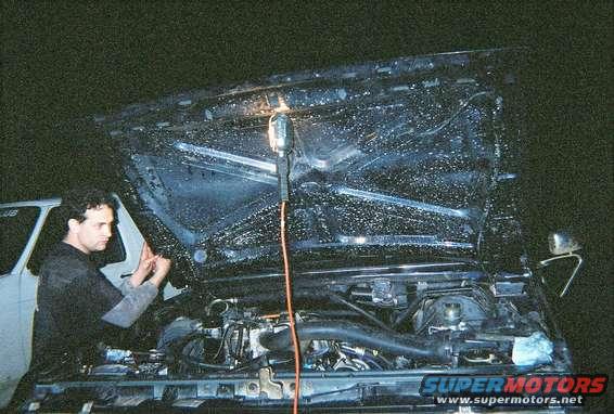 engine2_11.jpg Shane working on tuning the beast.  Notice the dirty INSIDE of my hood, I was playing in some puddles (more like lakes) before the engine went, wonder if that had something to do with it.