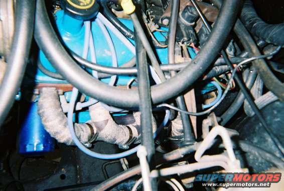 engine2_14.jpg Driver's side, I know the hose clamps are exactly bling bling, but they work.  The wrap is suppose to increase horsepower, now all I need is a Nike Swoop and it will be a 50hp gain.