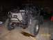 1984 Ford Bronco - This custom off-road vehicle appears to be undergoing modifications or repairs in a workshop setting.