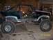 1984 Ford Bronco - This heavily modified vehicle, likely a Ford Bronco from the early 1980s, has been stripped down and fitted with a roll cage and oversized…