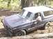 1986 Ford Bronco - This Ford Bronco appears to be from the early 1980s, not 1986, as it navigates a rough off-road path.