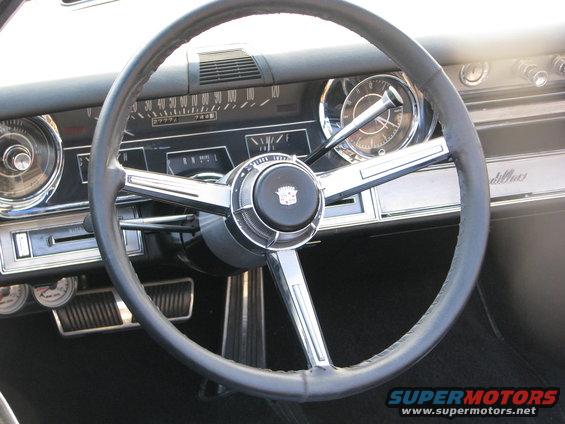 Interior dashboard with Cadillac emblem on steering wheel