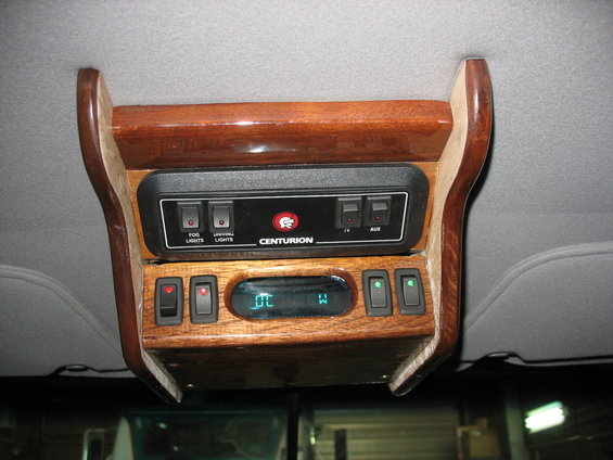 Overhead console with Centurion badging and multiple switches
