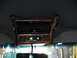 1995 Ford C-350 (Centurion Conversions) - Interior overhead console with wood trim, climate controls, and a Centurion radio.