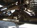 1978 Jeep Cherokee - Close-up view of a vehicle's undercarriage, focusing on the differential and suspension system.