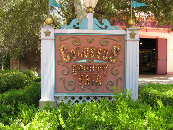 Sign for Colossus County Fair with illuminated letters