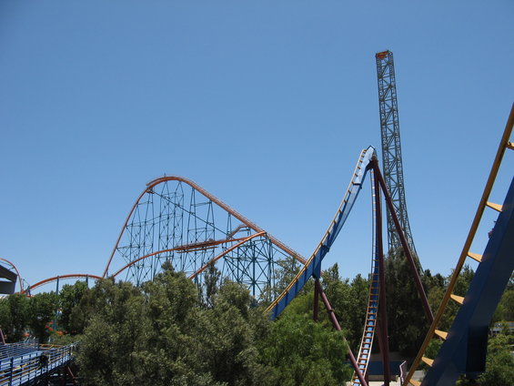 roller coaster tracks against a clear blue sky