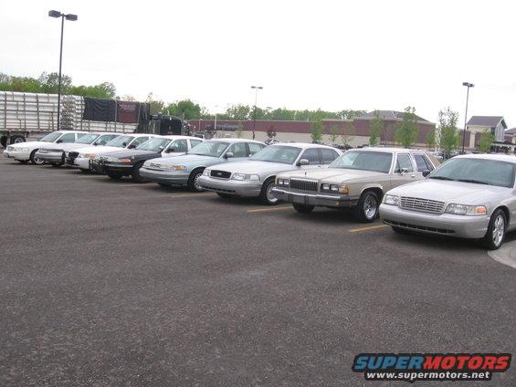 1988 Mercury Grand Marquis and other sedans parked in a lot