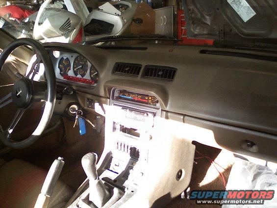 1983 Mazda RX-7 interior showing dashboard, steering wheel, and center console