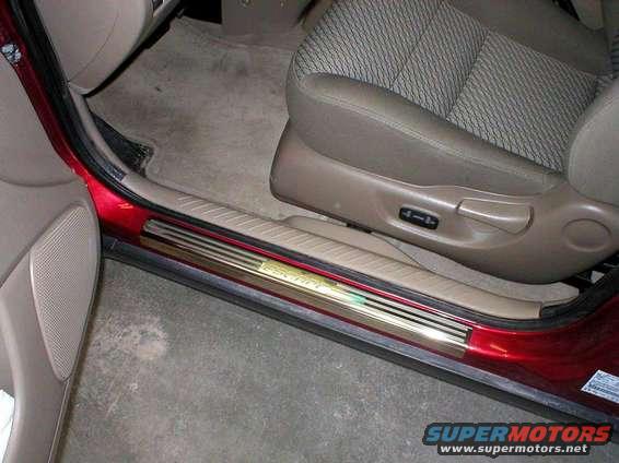 scuff1.jpg Here's a little classy enhancement as well as being very practical.
We picked up a set of 4 stainless steel scuff guards from the local Ford dealer for $79.99.
Takes about 10 minutes to install all 4.
Make sure you clean the area well, so the peal and stick adhesive backing will adhere well.