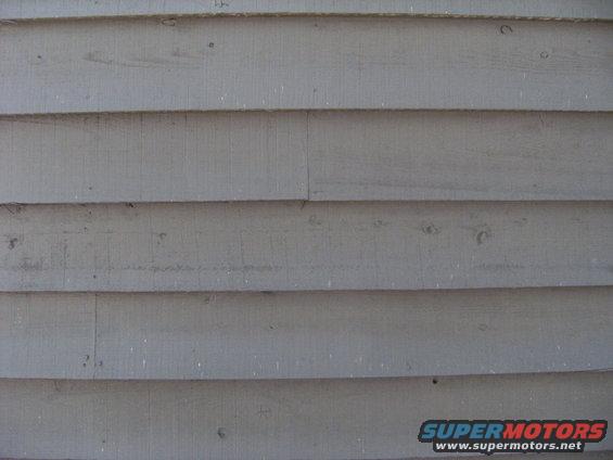 Close-up of gray wooden siding on a building