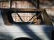 1996 Ford Bronco - A dog rests inside a 1996 Ford Bronco with its soft top up.