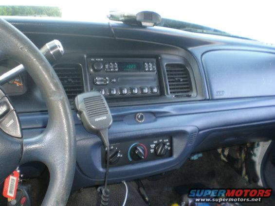 Interior of a 1996 Ford Crown Victoria with a Kenwood microphone and aftermarket radio