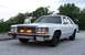 1985 Ford Crown Victoria LTD - This 1985 Ford Crown Victoria LTD features distinctive orange lights integrated into its front grille.