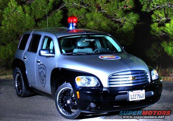 Police-style SUV with a light bar on top and 'Ridgecrest Police' on the door