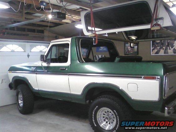 1978 Ford Bronco, green and white, 3/4 front view, removable top stored above