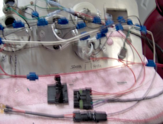 I'm going to tie in to the factory dash wiring and install the female 6 plug connector on the truck. The 6 plug connector from the new dash will plug into it. The other 2 wire plug is for 12 volt key-on power and the ground.