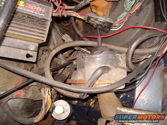 Engine bay with wiring, an EL 300+ ignition box, and transmission components visible