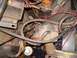 1988 Ford Bronco - Close-up of engine bay wiring and electronic control unit, with transmission linkage visible.
