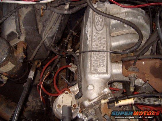 Ford engine intake manifold with "ELECTRONIC FUEL INJECTION" text