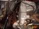 1988 Ford Bronco - Close-up of a Ford engine's intake manifold, clearly labeled "ELECTRONIC FUEL INJECTION".