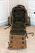 1991 Ford Bronco - An open backpack with various compartments is displayed on a carpeted surface.