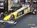 1973 Ford Mustang - A U.S. Army dragster is being serviced in a garage environment, with tools and equipment visible.