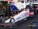 1973 Ford Mustang - A dragster with Lucas Motor Oils branding is being worked on in a garage setting.