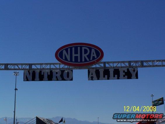 NHRA Nitro Alley sign over a drag strip with a date stamp of 12/04/2008