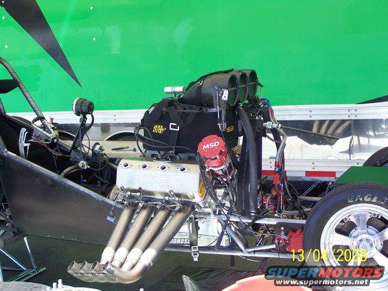 Dragster engine with BAE valve covers and MSD ignition, visible exhaust headers and intake manifold
