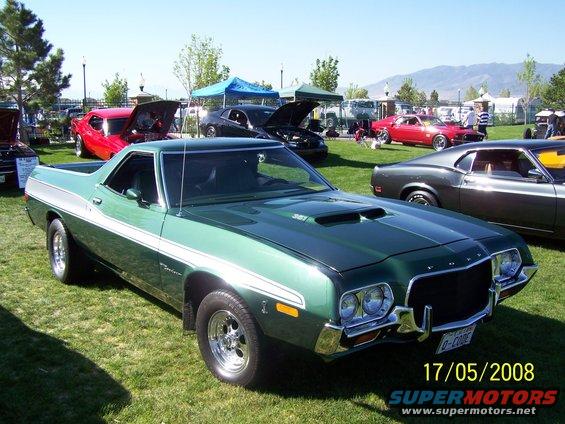Green 1972 Ford Ranchero with white side stripe and hood scoop